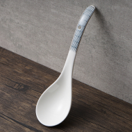 American porcelain two curved spoon